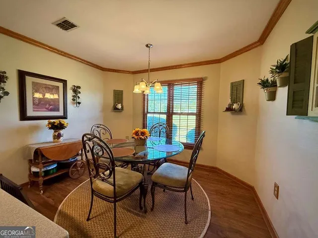 a view of a house with yard and lake view