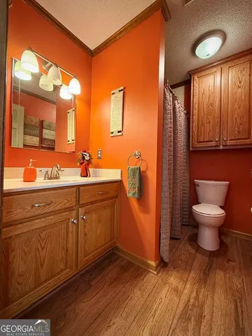 a living room with lots of furniture and kitchen view