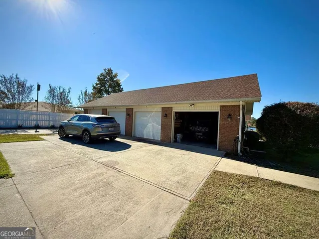 a view of a chairs and table in the patio