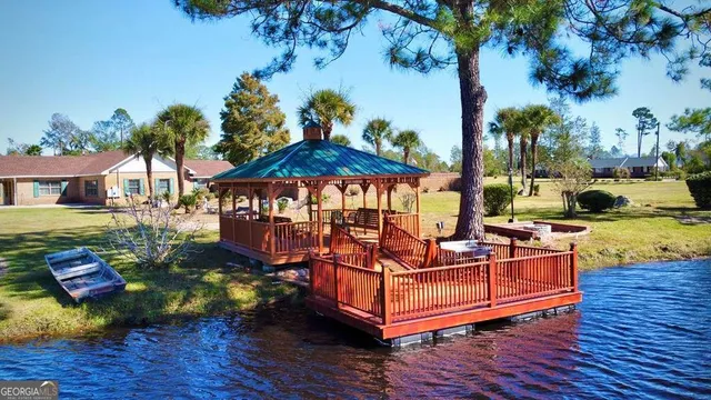 a view of a swimming pool with a table and chairs