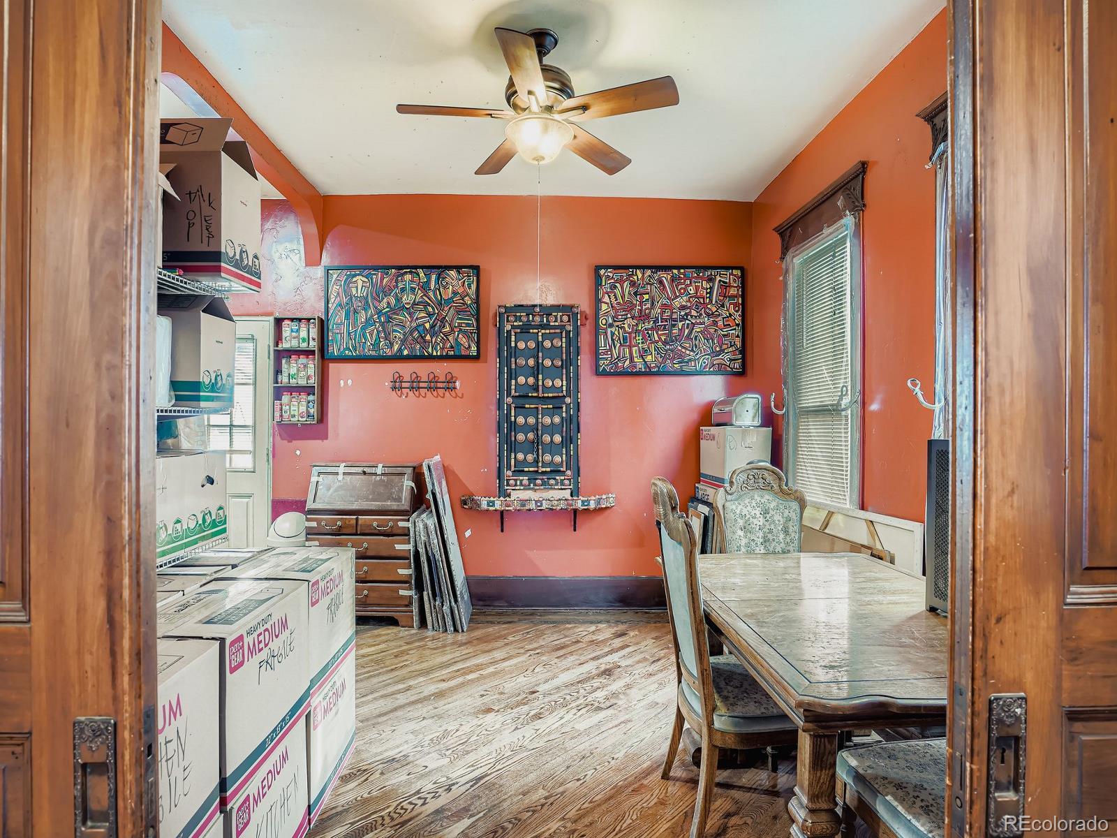 2516 North Marion Street Denver, CO 80205 - Photo 11 of 31 a dining room with furniture and a chandelier fan