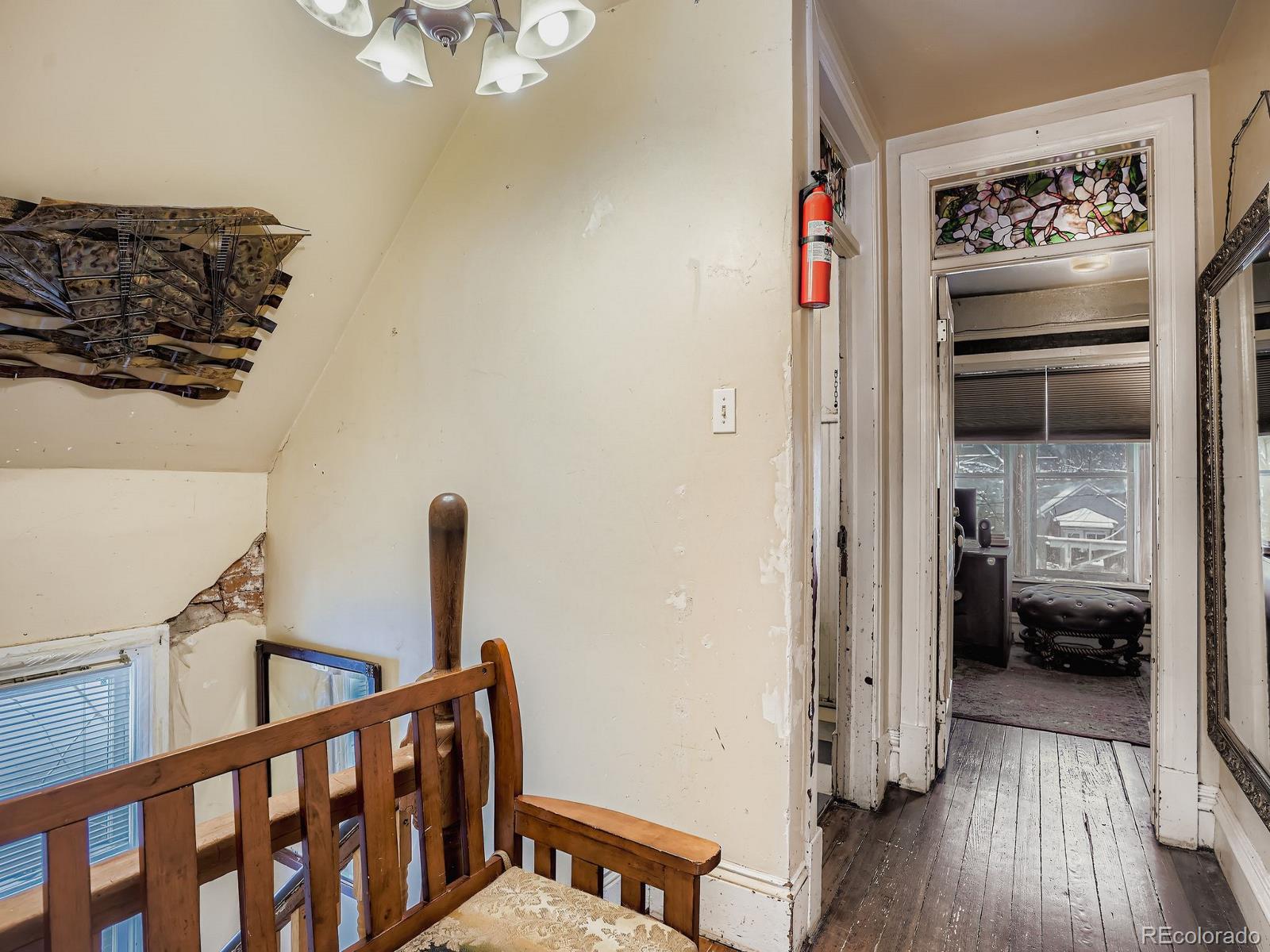 2516 North Marion Street Denver, CO 80205 - Photo 16 of 31 a view of hallway with furniture and wooden floor