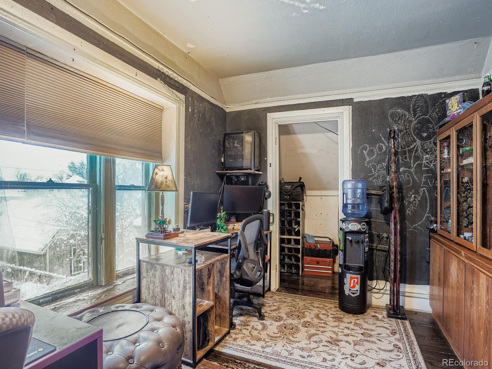 2516 North Marion Street Denver, CO 80205 - Photo 17 of 31 a room with furniture and a window