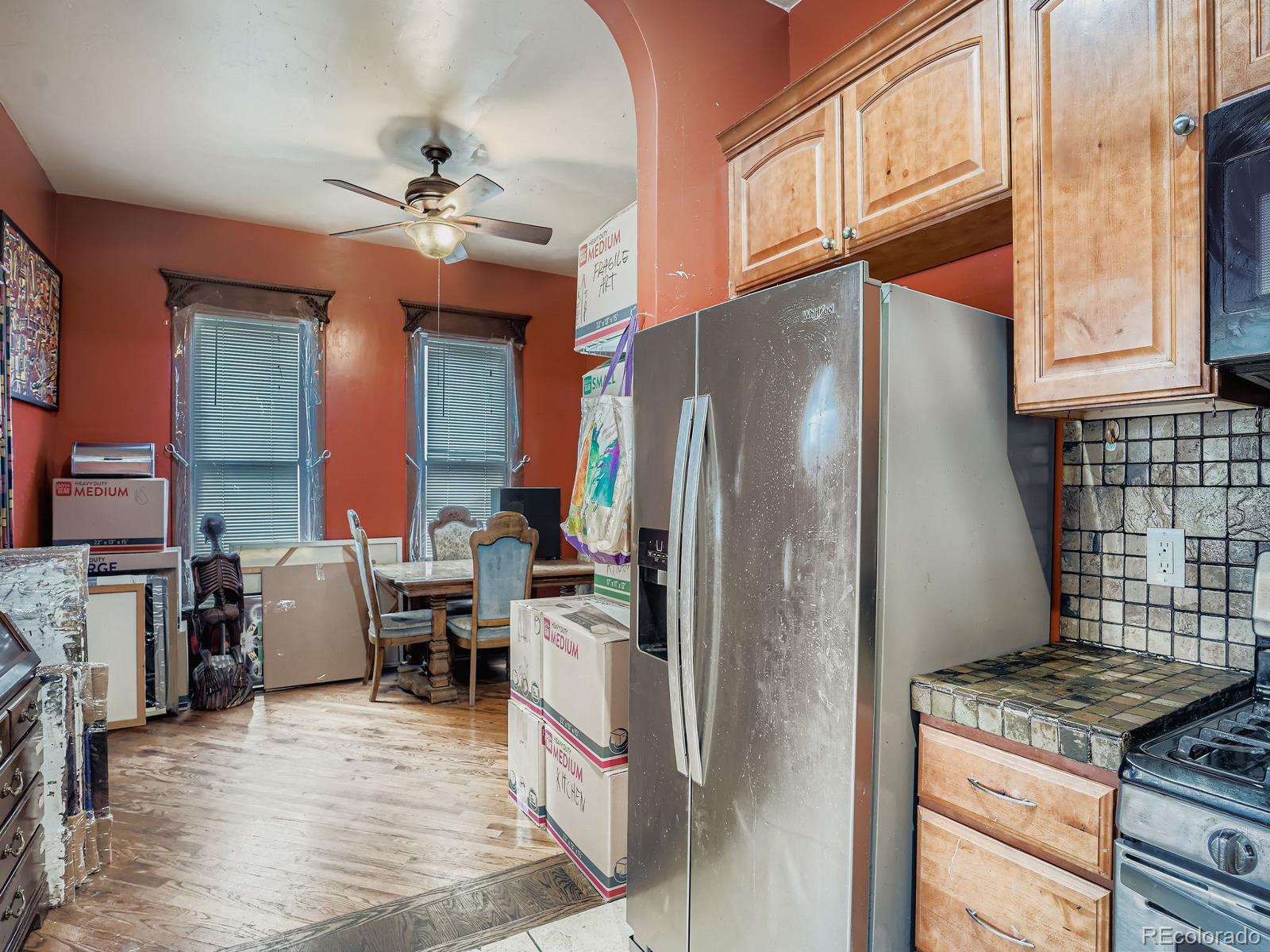 2516 North Marion Street Denver, CO 80205 - Photo 21 of 31 a kitchen with stainless steel appliances granite countertop a refrigerator a stove and a sink