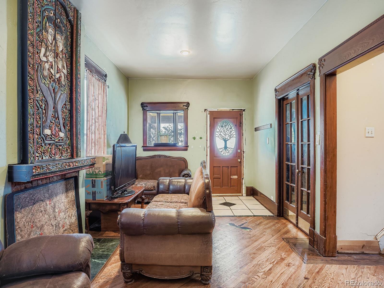 2516 North Marion Street Denver, CO 80205 - Photo 8 of 31 a living room with furniture and a window