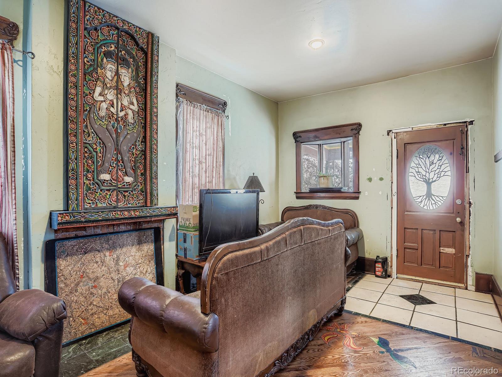 2516 North Marion Street Denver, CO 80205 - Photo 9 of 31 a living room with furniture and a flat screen tv