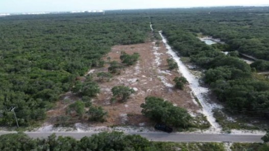 an aerial view of house with yard