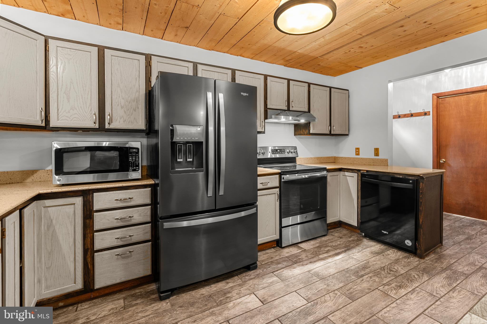 1003 Jackson Hall School Road Elkton, MD 21921 - Photo 19 of 49 a kitchen with stainless steel appliances a refrigerator sink and microwave
