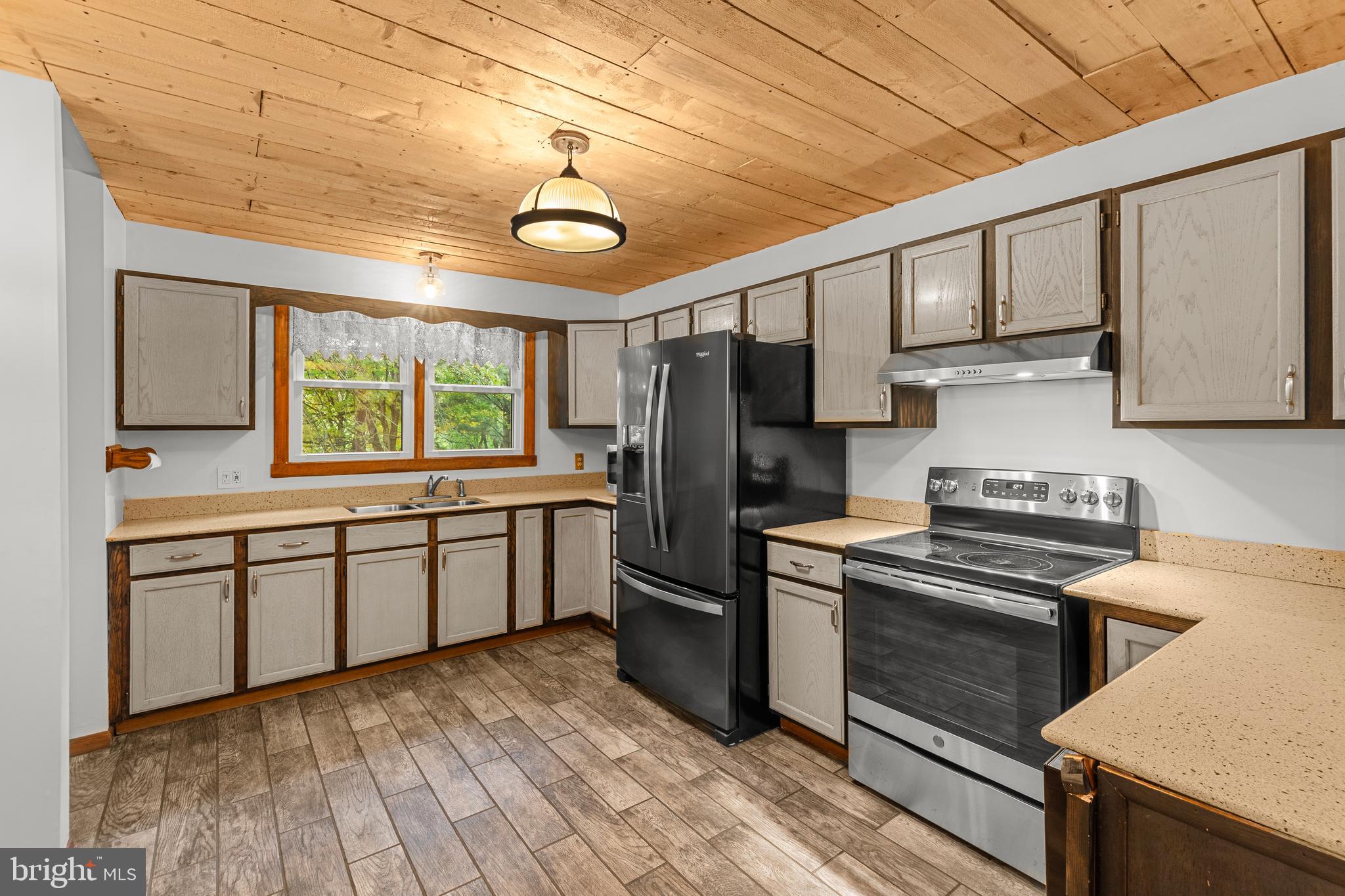 1003 Jackson Hall School Road Elkton, MD 21921 - Photo 20 of 49 a kitchen with a sink stove and refrigerator
