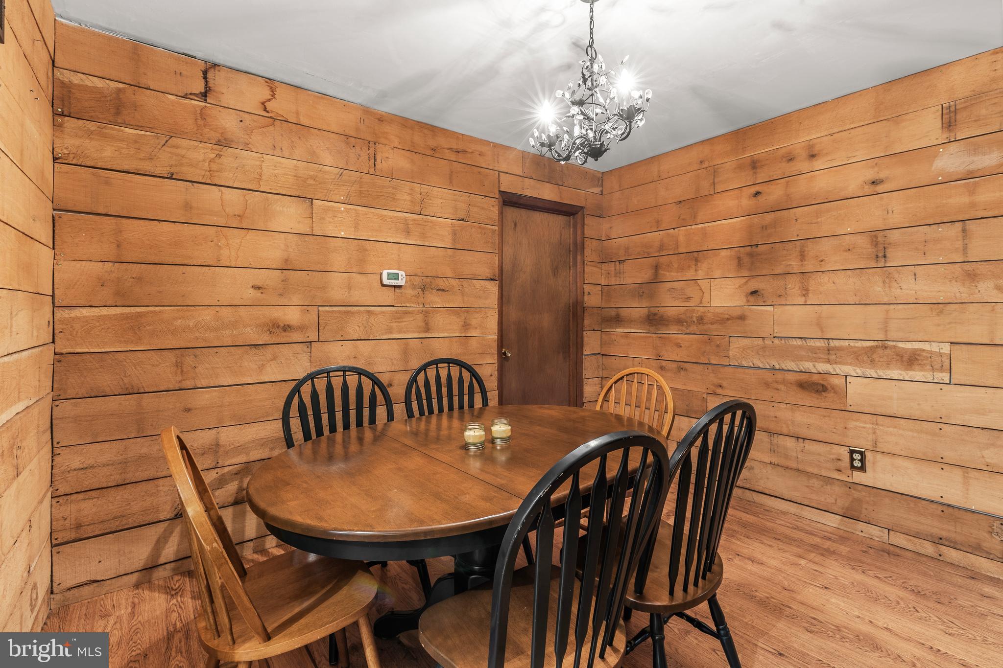 1003 Jackson Hall School Road Elkton, MD 21921 - Photo 23 of 49 a view of a dining room with furniture and wooden floor