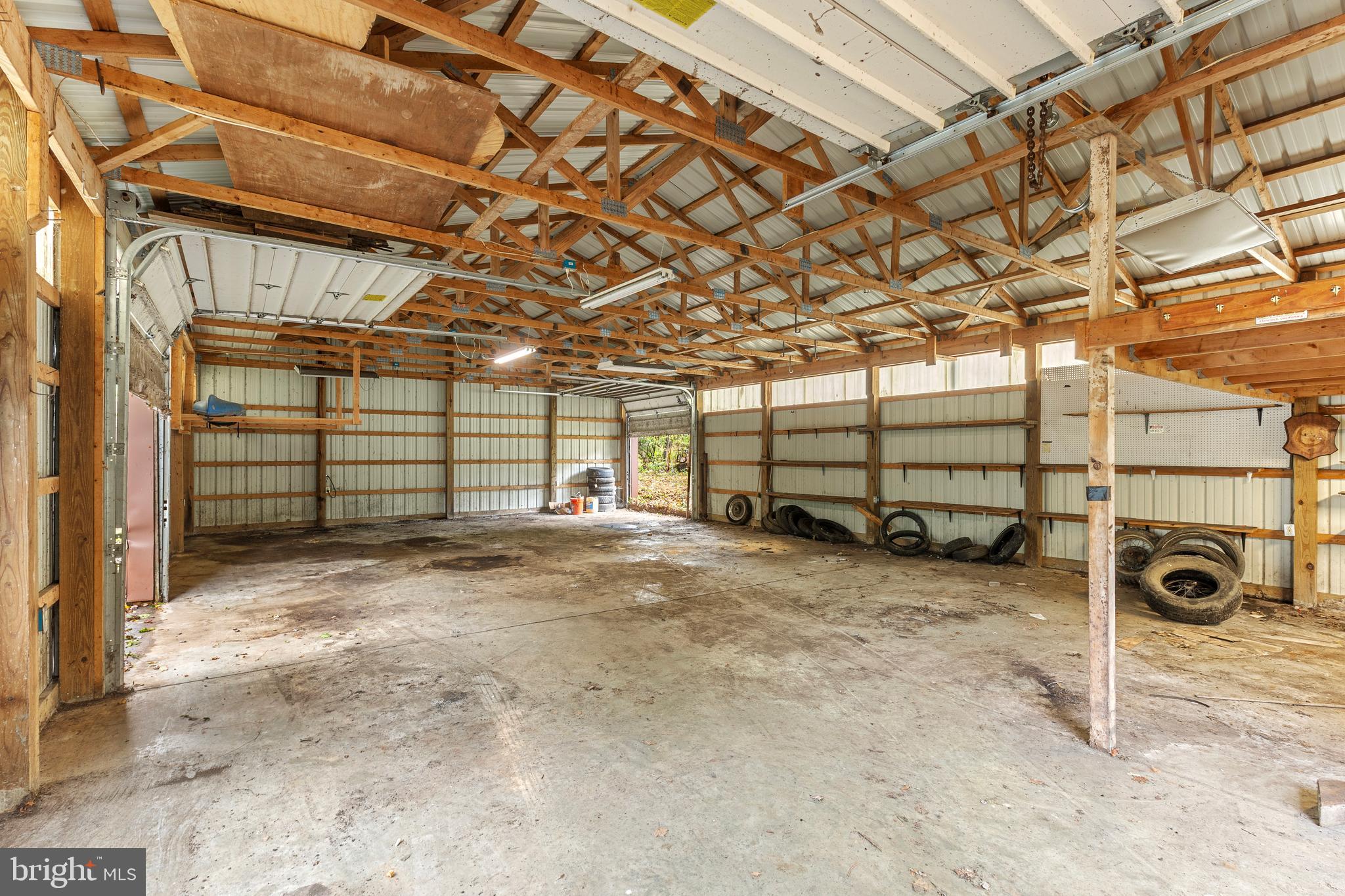 1003 Jackson Hall School Road Elkton, MD 21921 - Photo 41 of 49 a view of a garage with a ceiling fan