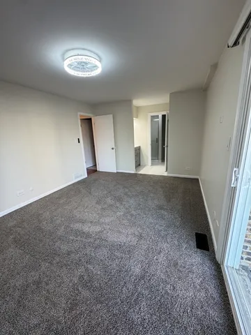 a bathroom with a shower and toilet