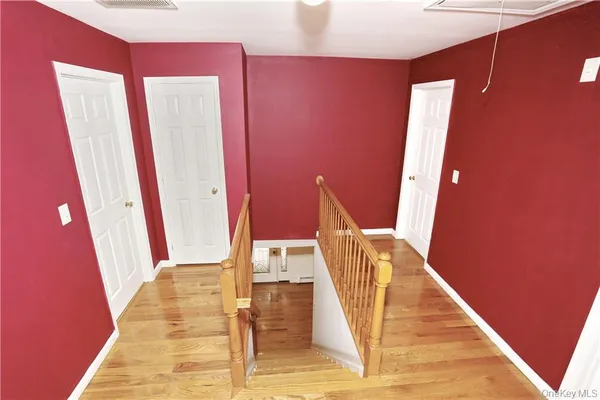 a view of front door with wooden floor