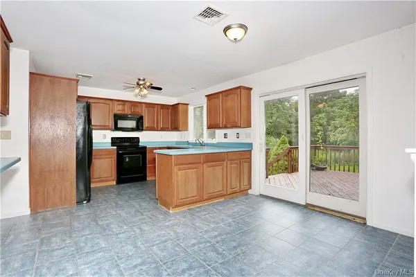 a kitchen with a stove a sink and a refrigerator