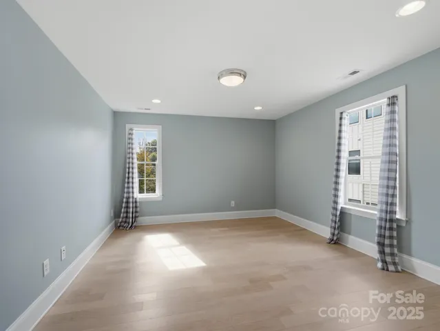 an empty room with windows