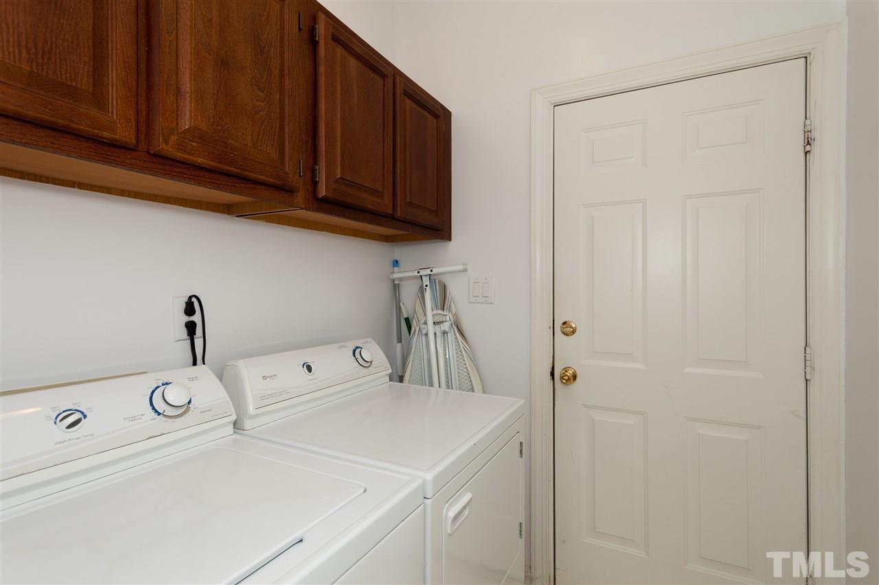 5817 Raddington Street Raleigh, NC 27613 - Photo 11 of 25 a utility room with dryer and washer