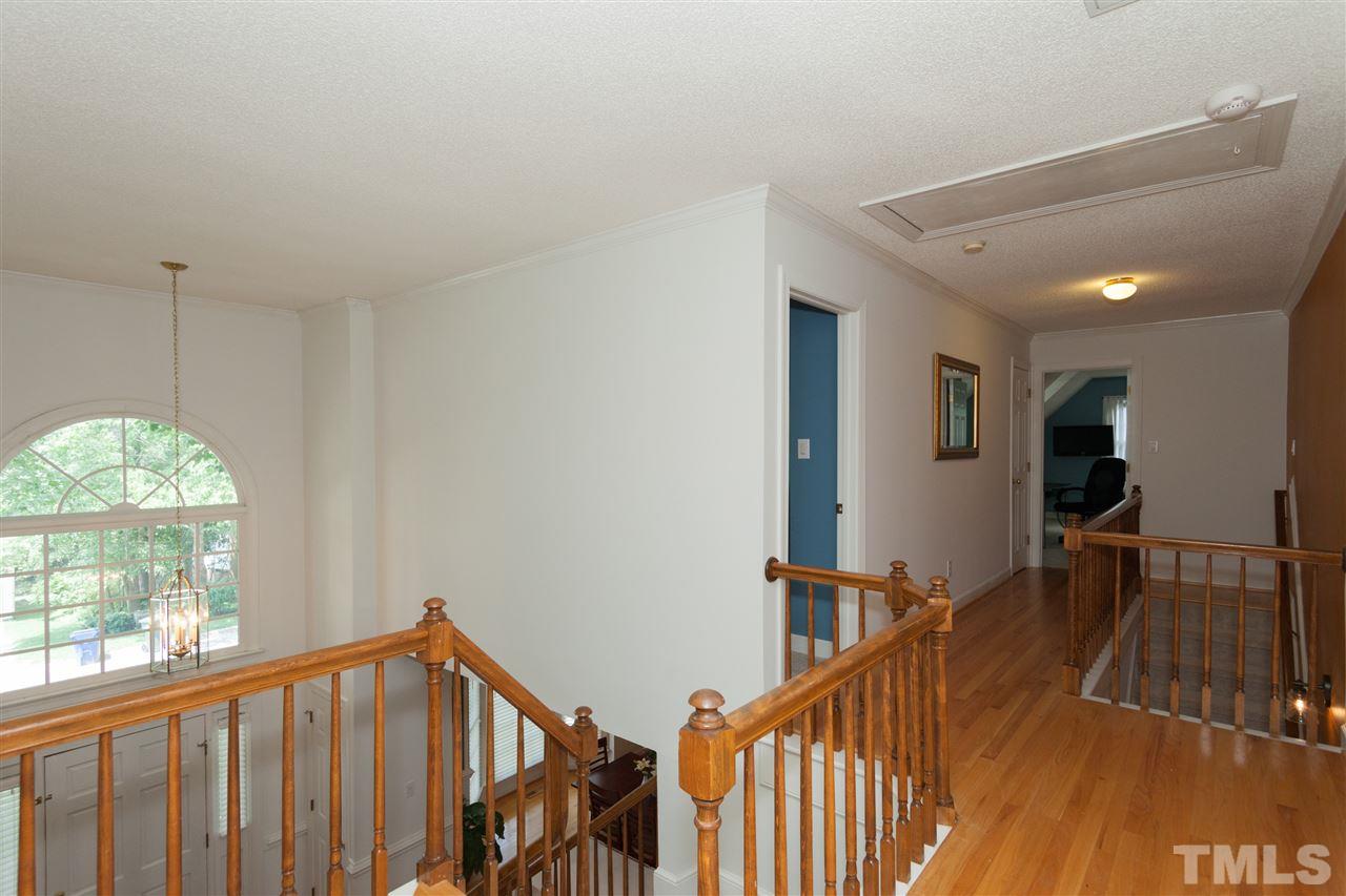 5817 Raddington Street Raleigh, NC 27613 - Photo 18 of 25 a view of entryway with wooden floor