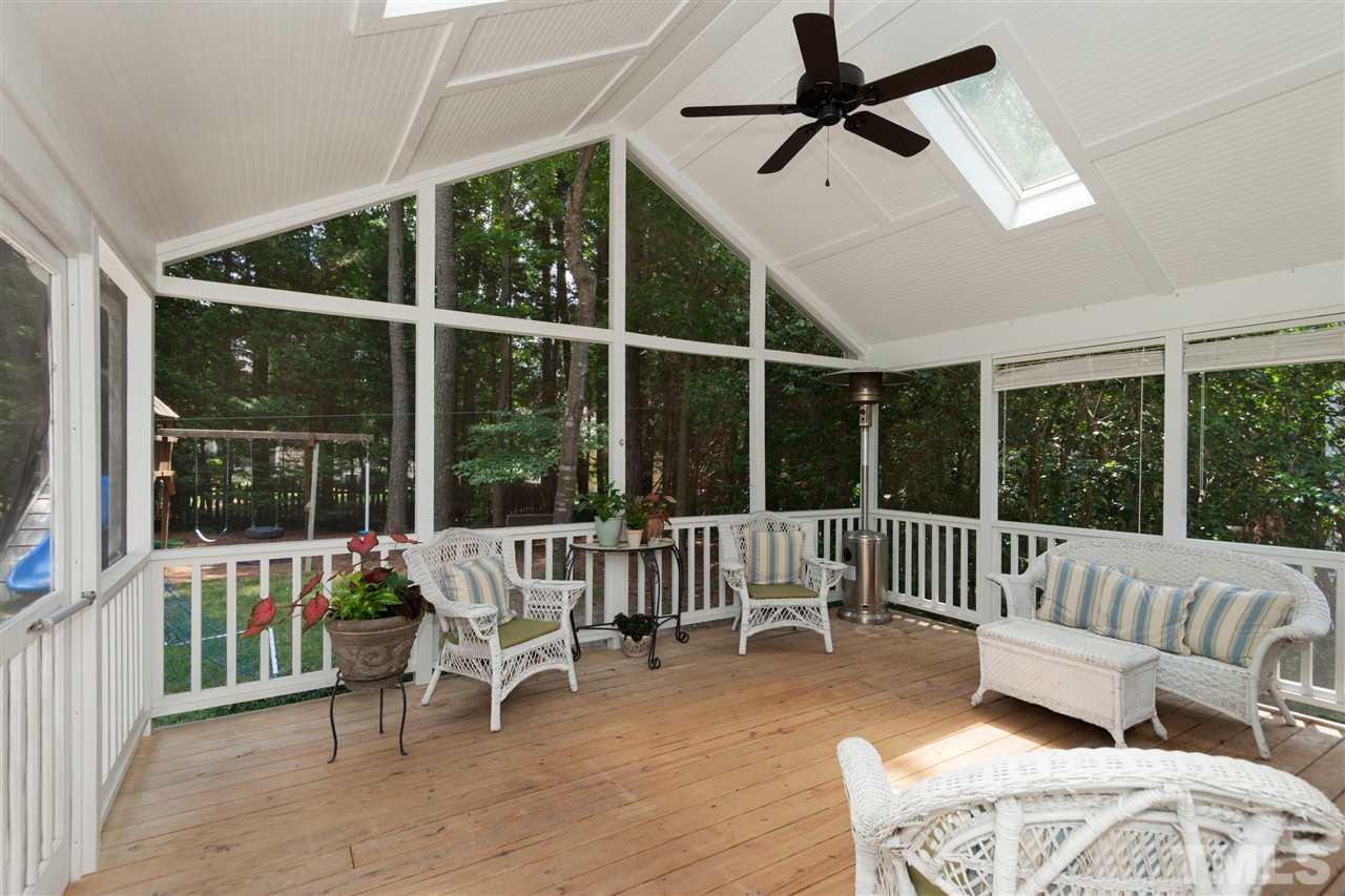 5817 Raddington Street Raleigh, NC 27613 - Photo 23 of 25 a view of a patio with a dining table and chairs