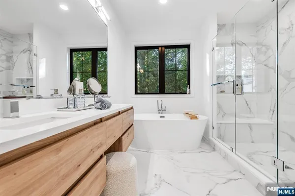 a large bathroom with a bathtub and a sink