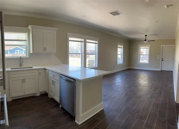 a kitchen with a sink and dish washer