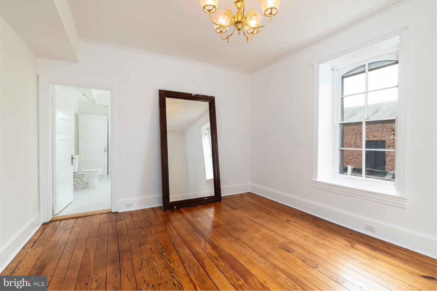 28 East Johnson Street Philadelphia, PA 19144 - Photo 12 of 24 an empty room with wooden floor and windows