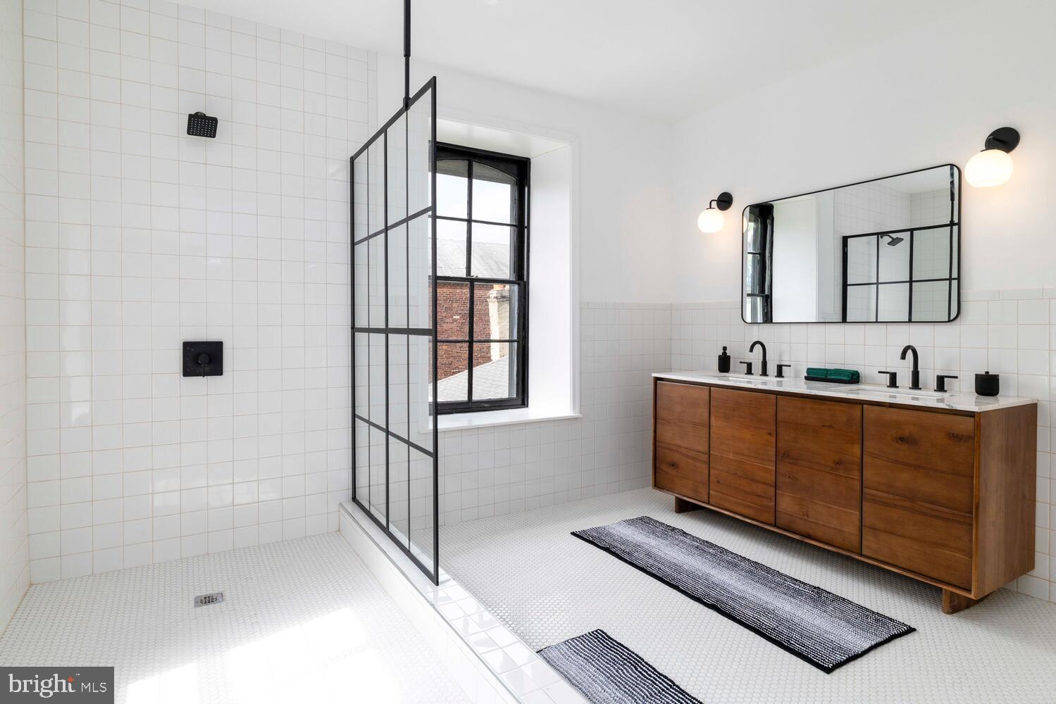 28 East Johnson Street Philadelphia, PA 19144 - Photo 14 of 24 a bathroom with a tub sink and mirror