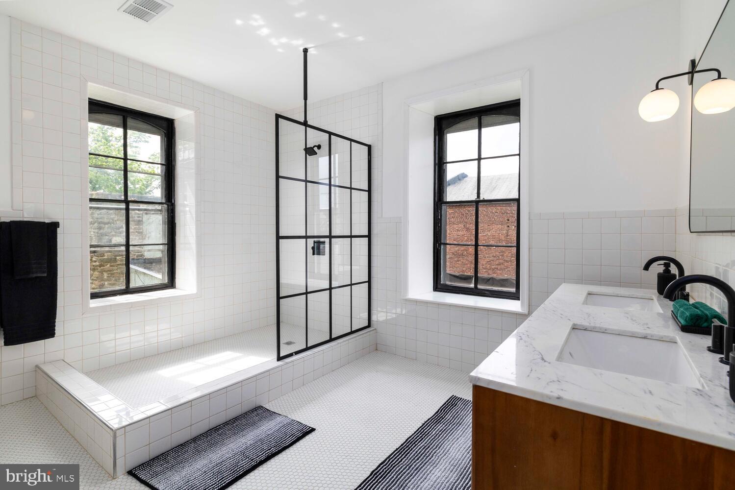 28 East Johnson Street Philadelphia, PA 19144 - Photo 15 of 24 a kitchen with a sink a stove and a window