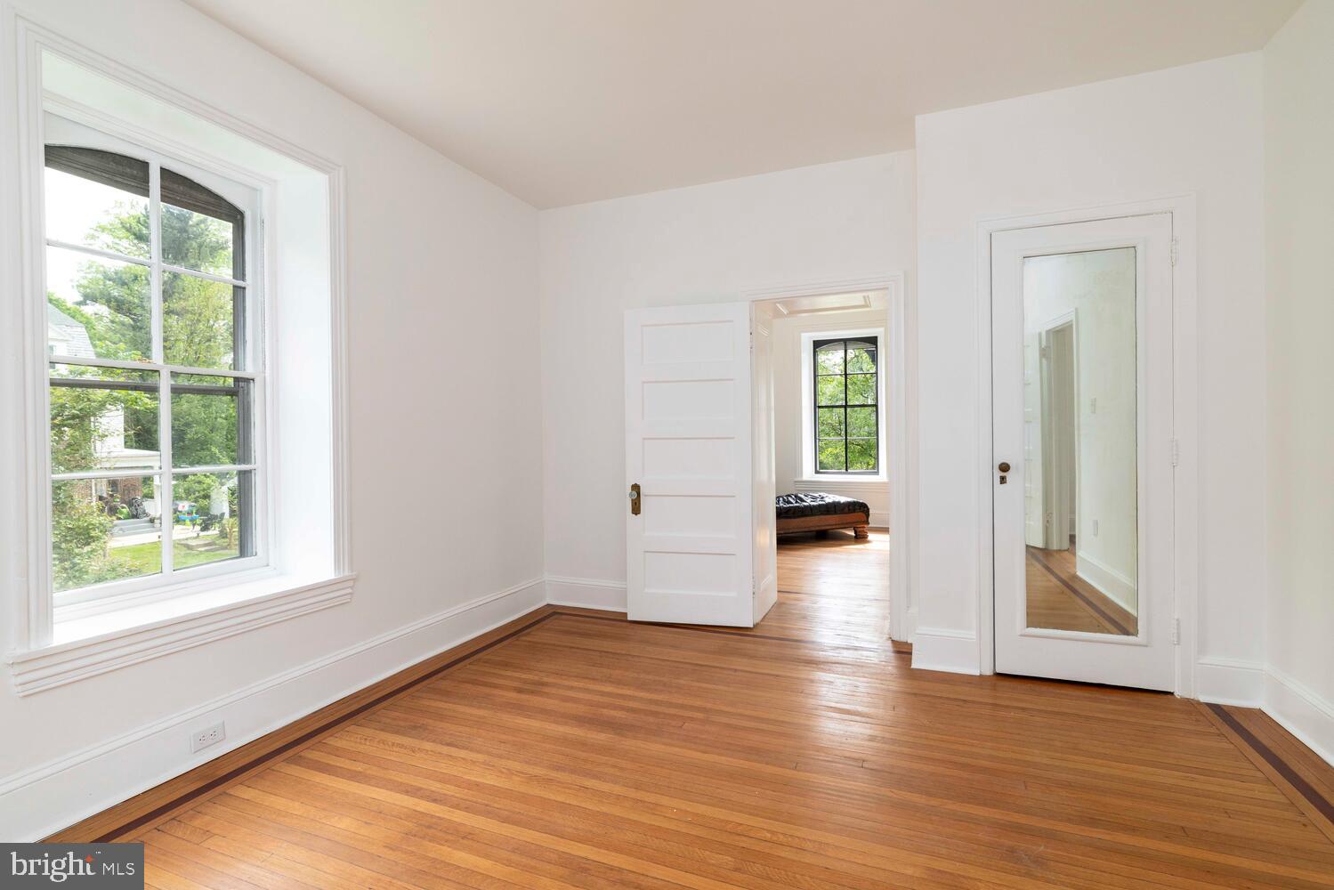 28 East Johnson Street Philadelphia, PA 19144 - Photo 18 of 24 a view of empty room with wooden floor and fan