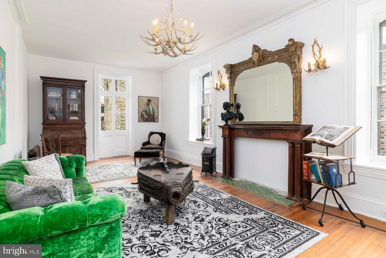 28 East Johnson Street Philadelphia, PA 19144 - Photo 6 of 24 a living room with furniture and a chandelier