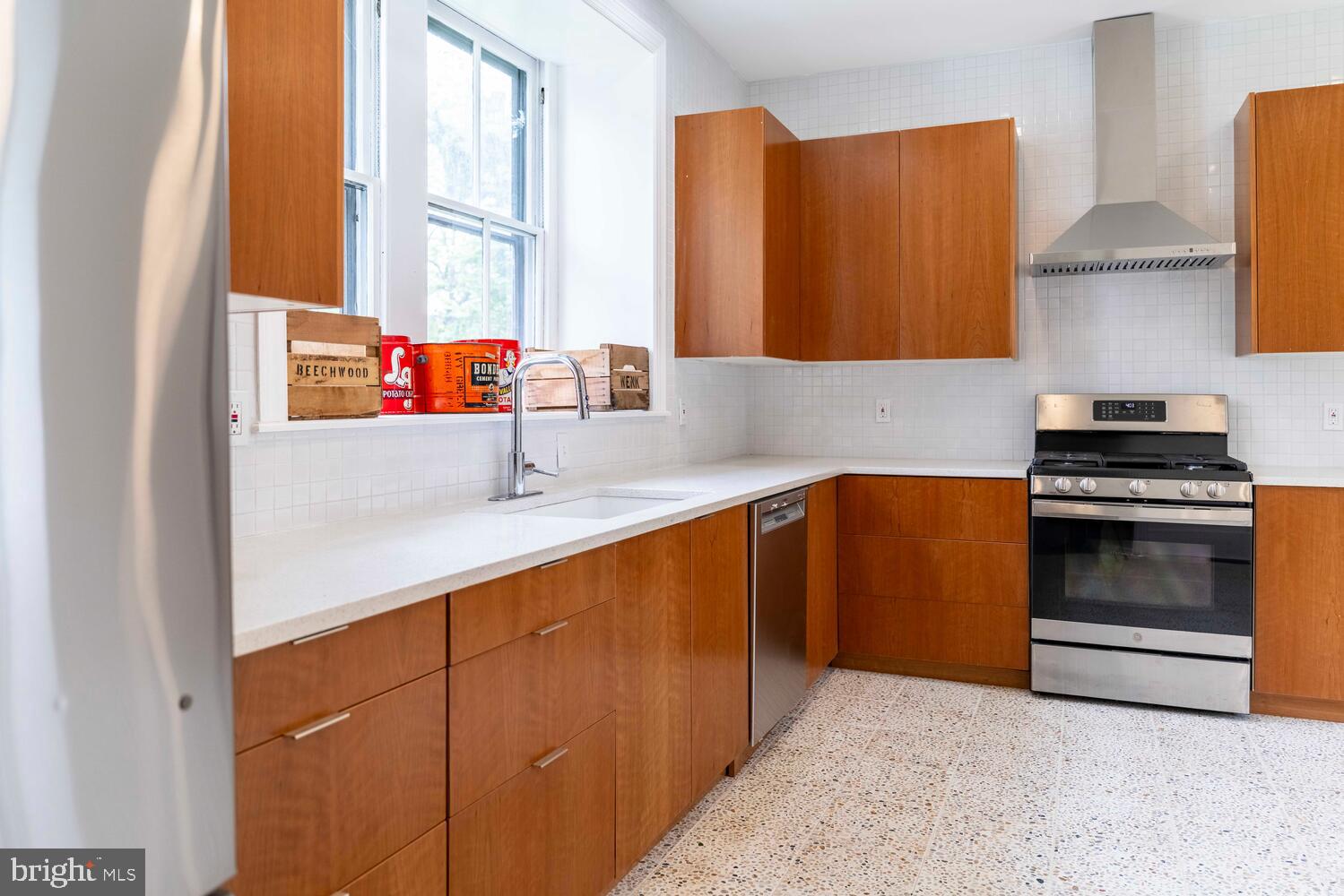 28 East Johnson Street Philadelphia, PA 19144 - Photo 9 of 24 a kitchen with granite countertop a sink and a stove
