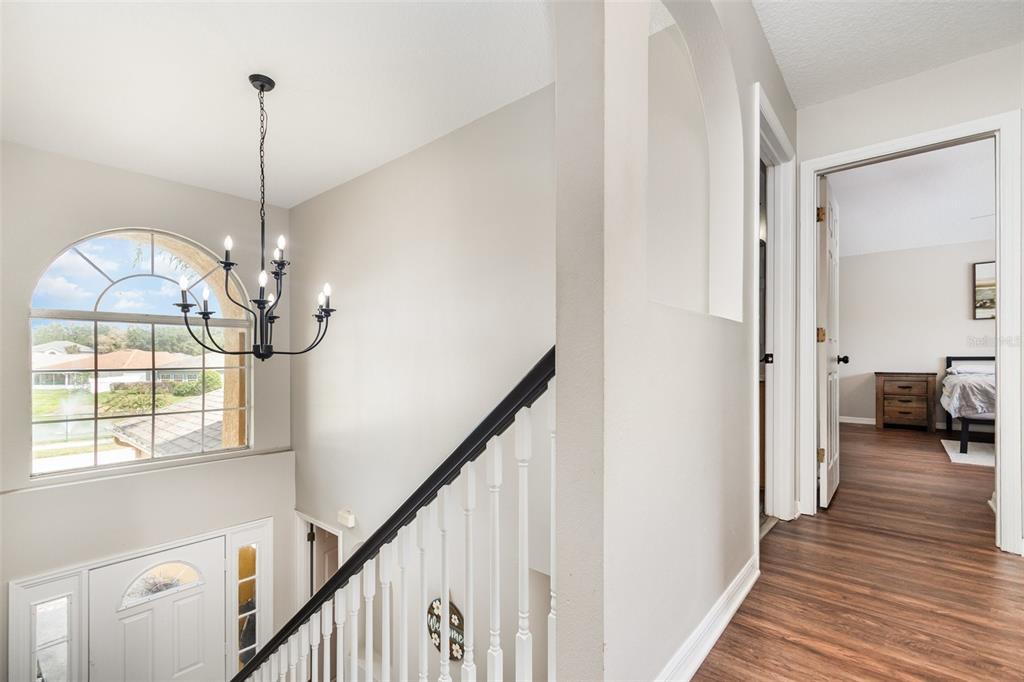 149 Circle Hill Road Sanford, FL 32746 - Photo 11 of 30 a view of a livingroom with wooden floor and stairs