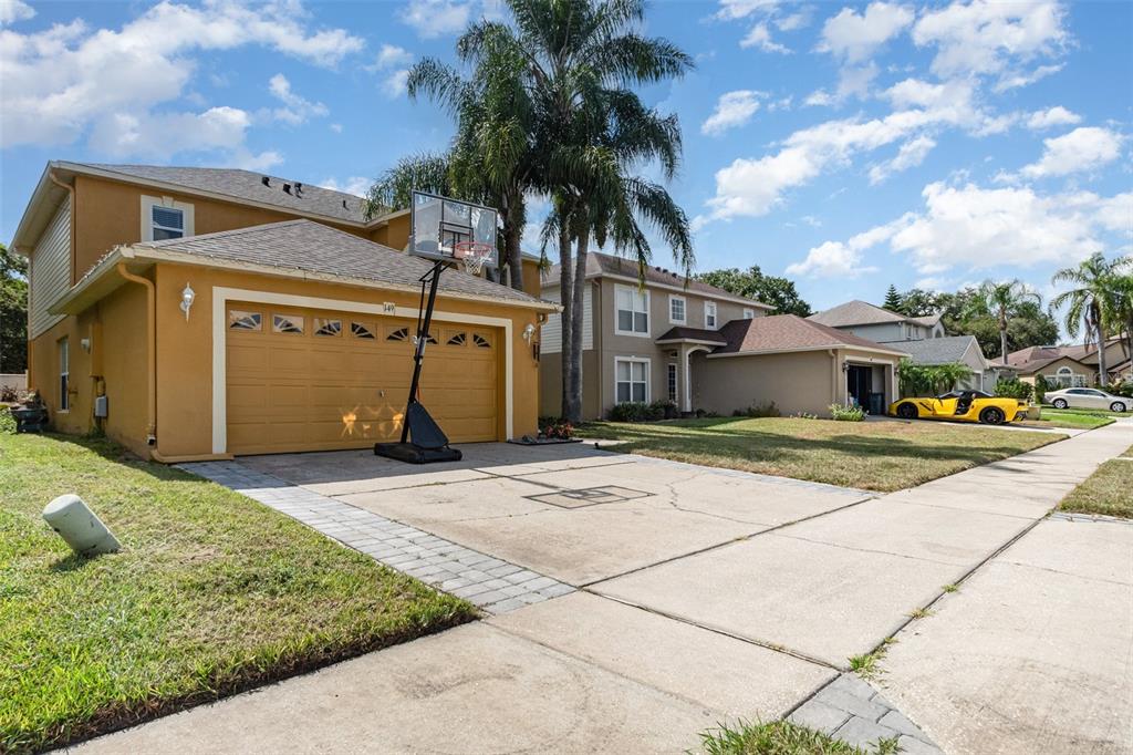 149 Circle Hill Road Sanford, FL 32746 - Photo 13 of 30 a front view of a house with a yard and garage