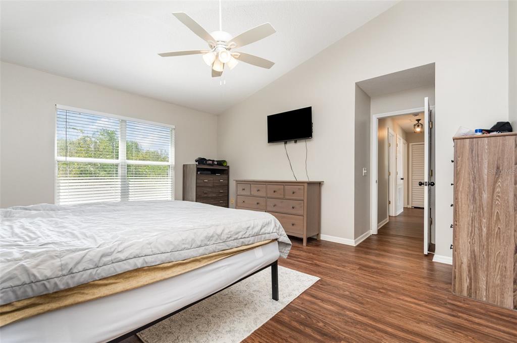 149 Circle Hill Road Sanford, FL 32746 - Photo 14 of 30 a bedroom with a bed and a television
