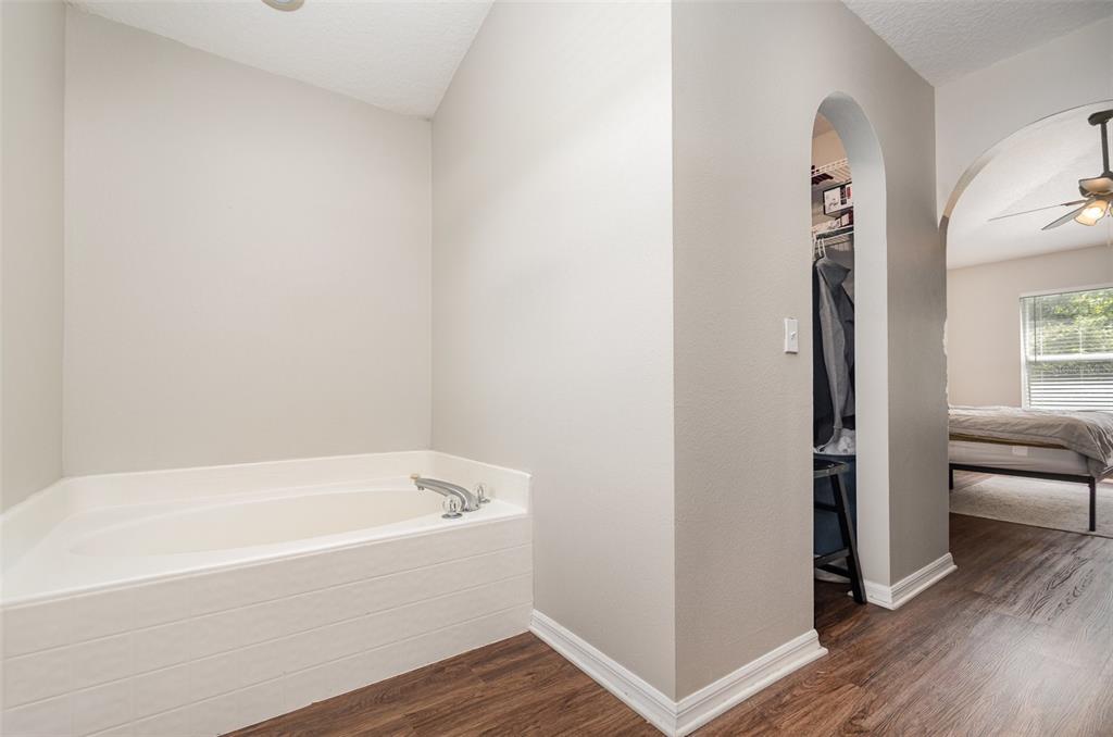 149 Circle Hill Road Sanford, FL 32746 - Photo 17 of 30 a white bath tub sitting next to a window