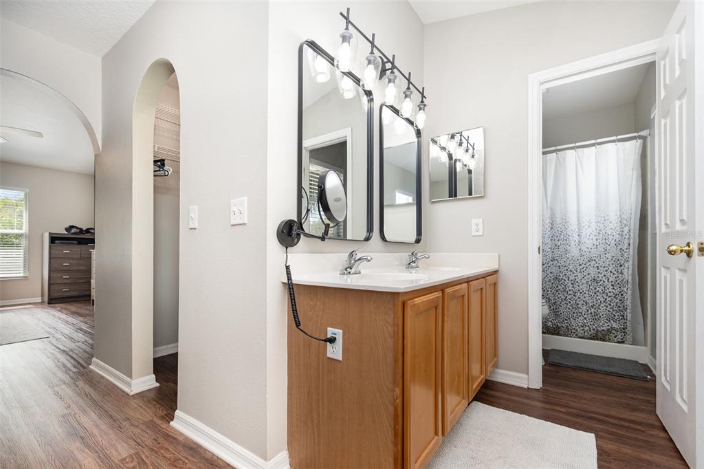 149 Circle Hill Road Sanford, FL 32746 - Photo 18 of 30 a bathroom with a sink and a mirror