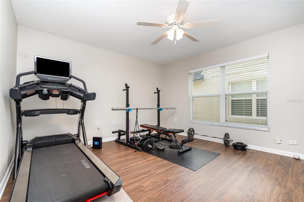 149 Circle Hill Road Sanford, FL 32746 - Photo 20 of 30 a living room with furniture a flat screen tv and a window