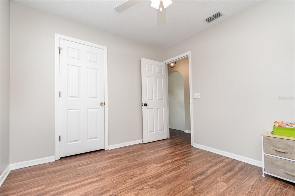 149 Circle Hill Road Sanford, FL 32746 - Photo 22 of 30 a view of an empty room with wooden floor