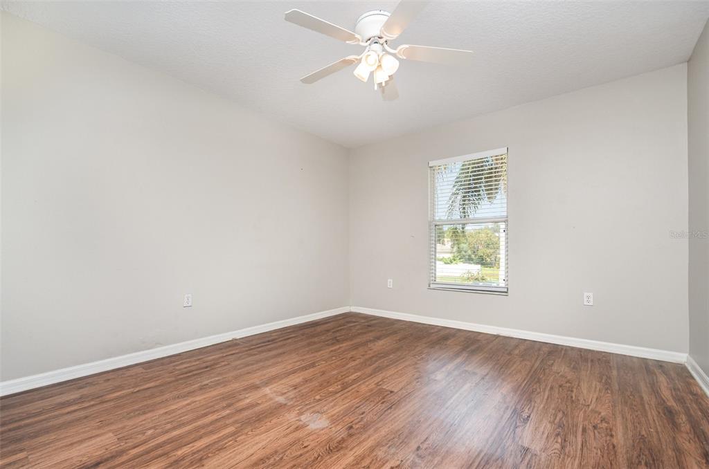 149 Circle Hill Road Sanford, FL 32746 - Photo 25 of 30 wooden floor in an empty room with a window