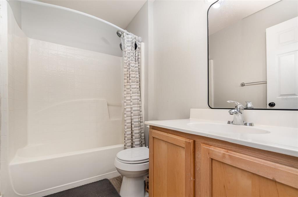 149 Circle Hill Road Sanford, FL 32746 - Photo 27 of 30 a bathroom with a sink a toilet and shower