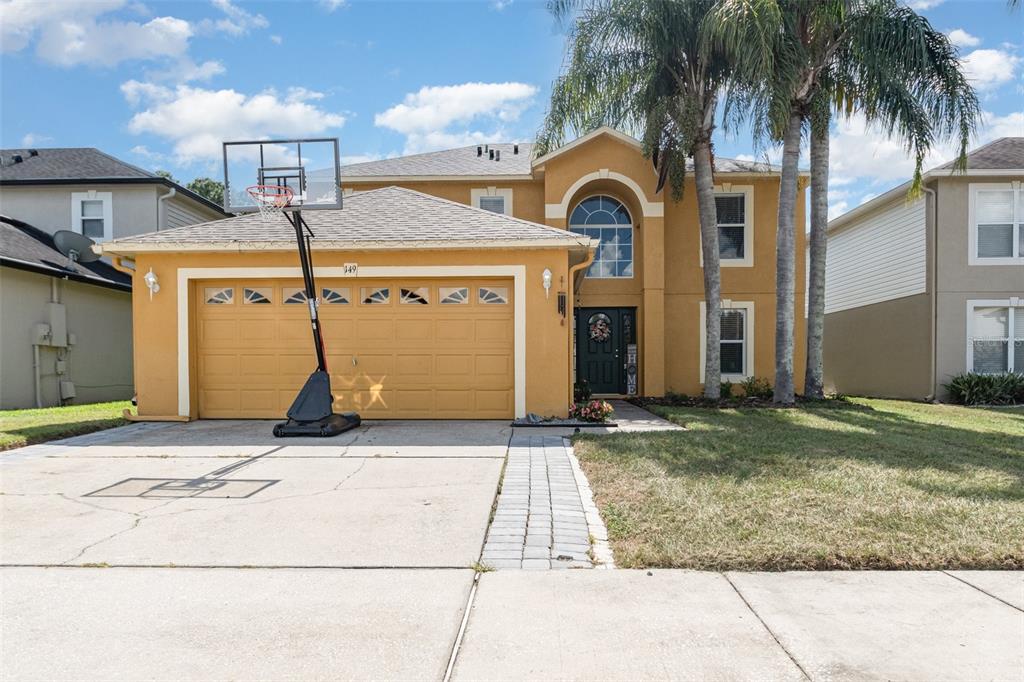 149 Circle Hill Road Sanford, FL 32746 - Photo 29 of 30 a front view of a house with garden