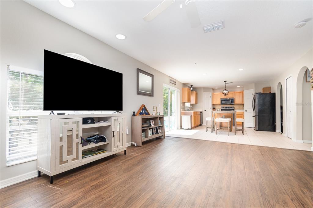 149 Circle Hill Road Sanford, FL 32746 - Photo 3 of 30 a living room with furniture and a flat screen tv