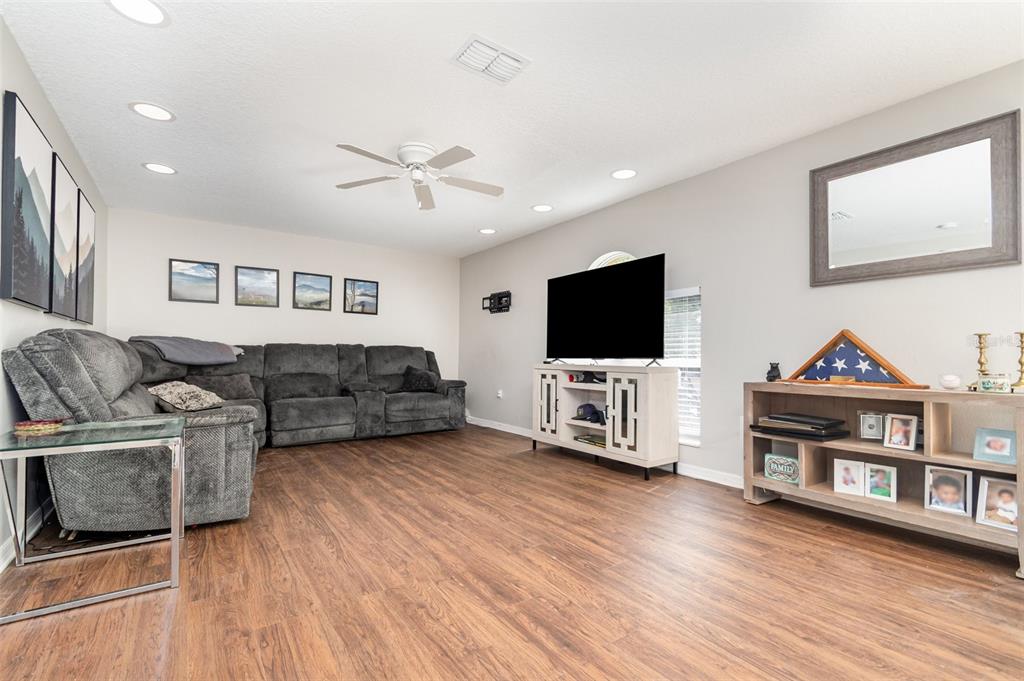 149 Circle Hill Road Sanford, FL 32746 - Photo 5 of 30 a living room with furniture and a flat screen tv