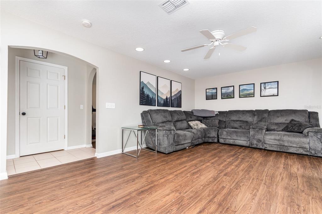 149 Circle Hill Road Sanford, FL 32746 - Photo 6 of 30 a living room with furniture and a wooden floor