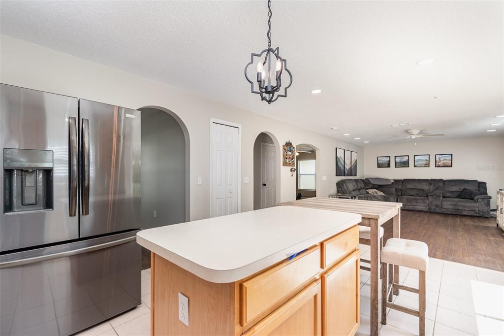 149 Circle Hill Road Sanford, FL 32746 - Photo 8 of 30 a kitchen with stainless steel appliances a refrigerator and a stove top oven