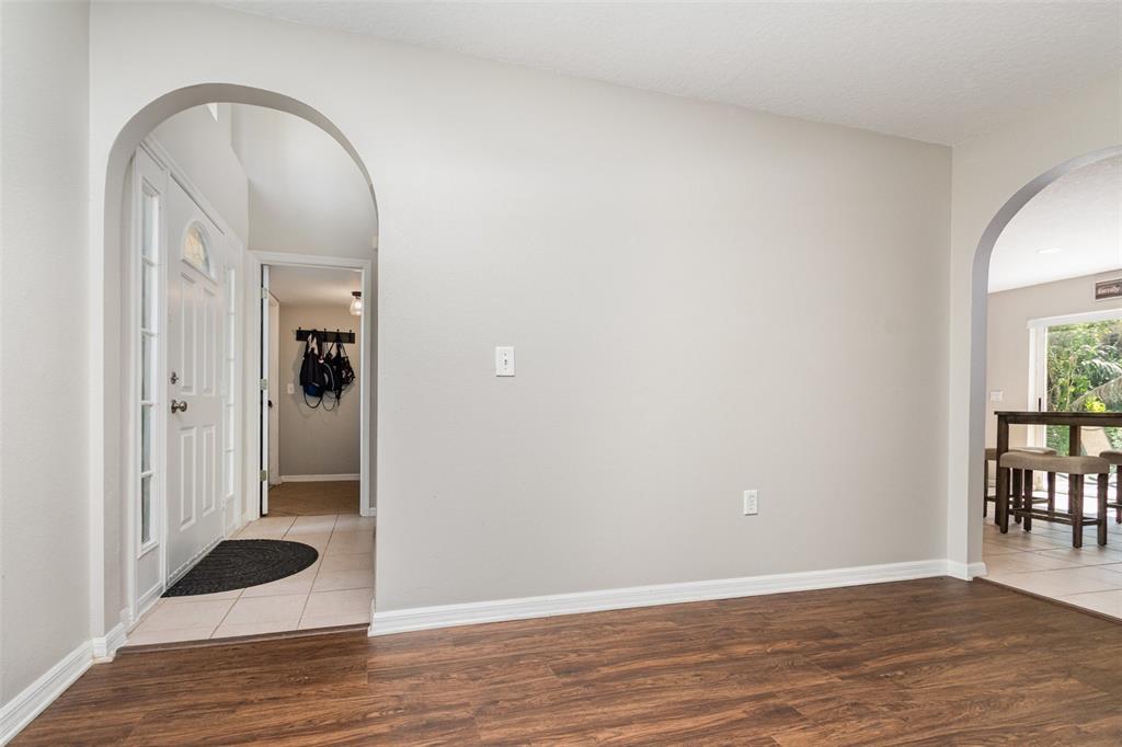 149 Circle Hill Road Sanford, FL 32746 - Photo 9 of 30 a view of a room with wooden floor and a window