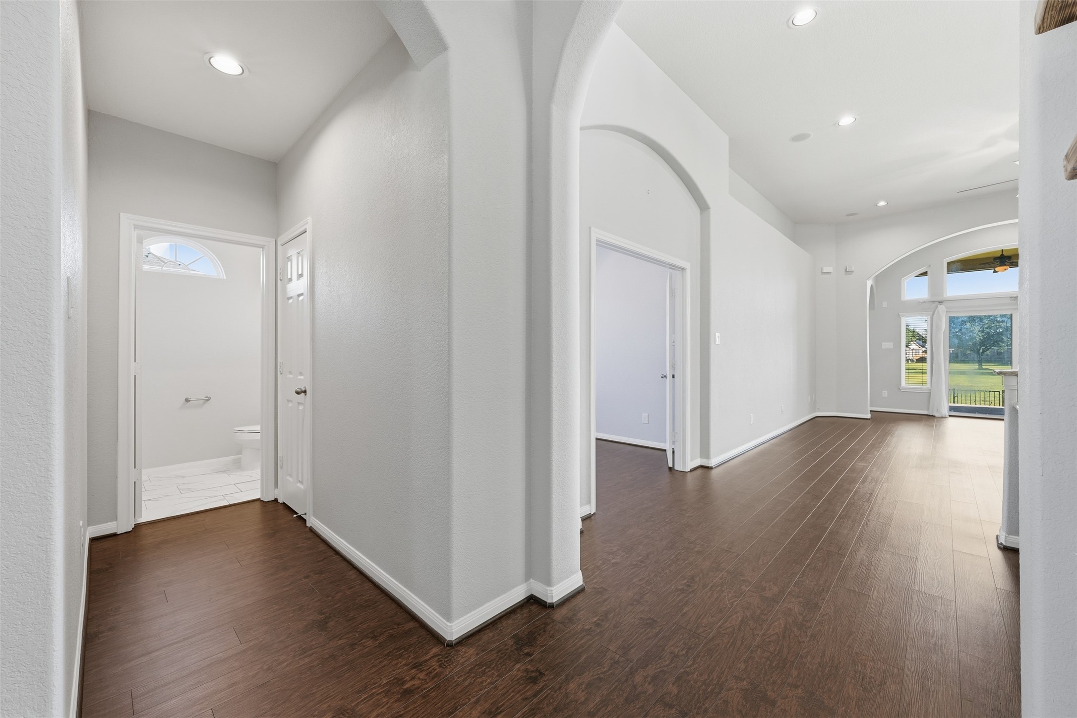 6011 Watford Bend Rosenberg, TX 77471 - Photo 11 of 48 an empty room with wooden floor and windows
