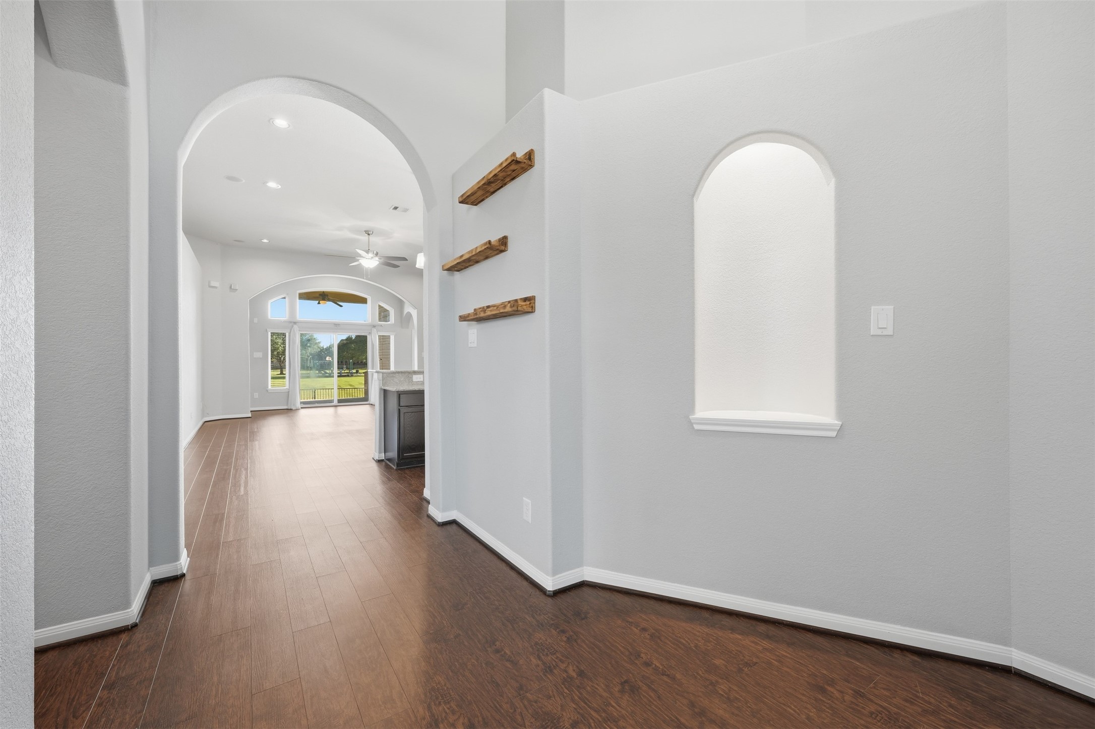 6011 Watford Bend Rosenberg, TX 77471 - Photo 7 of 48 an empty room with wooden floor and entrance