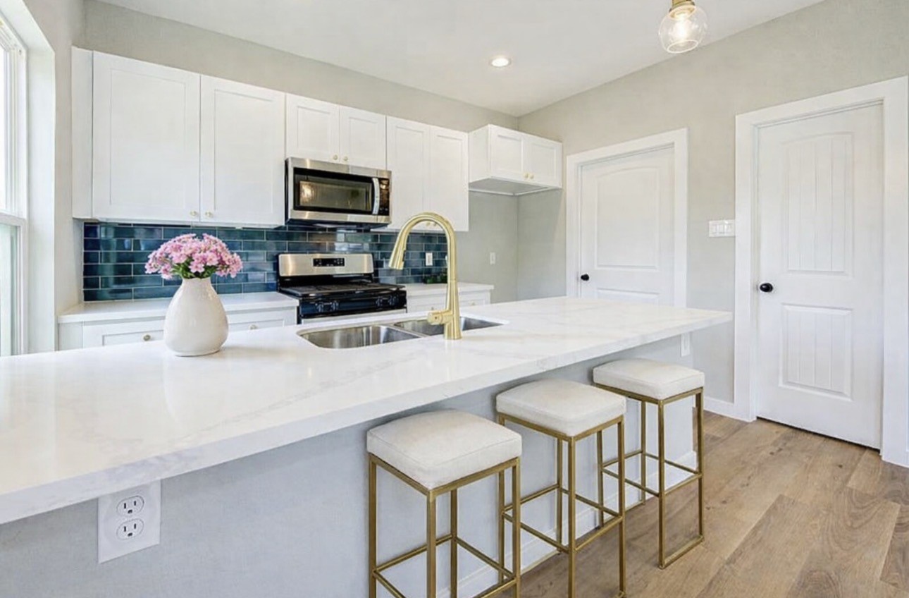 8361 Tate Street Houston, TX 77028 - Photo 1 of 16 a kitchen with stainless steel appliances granite countertop a sink and microwave