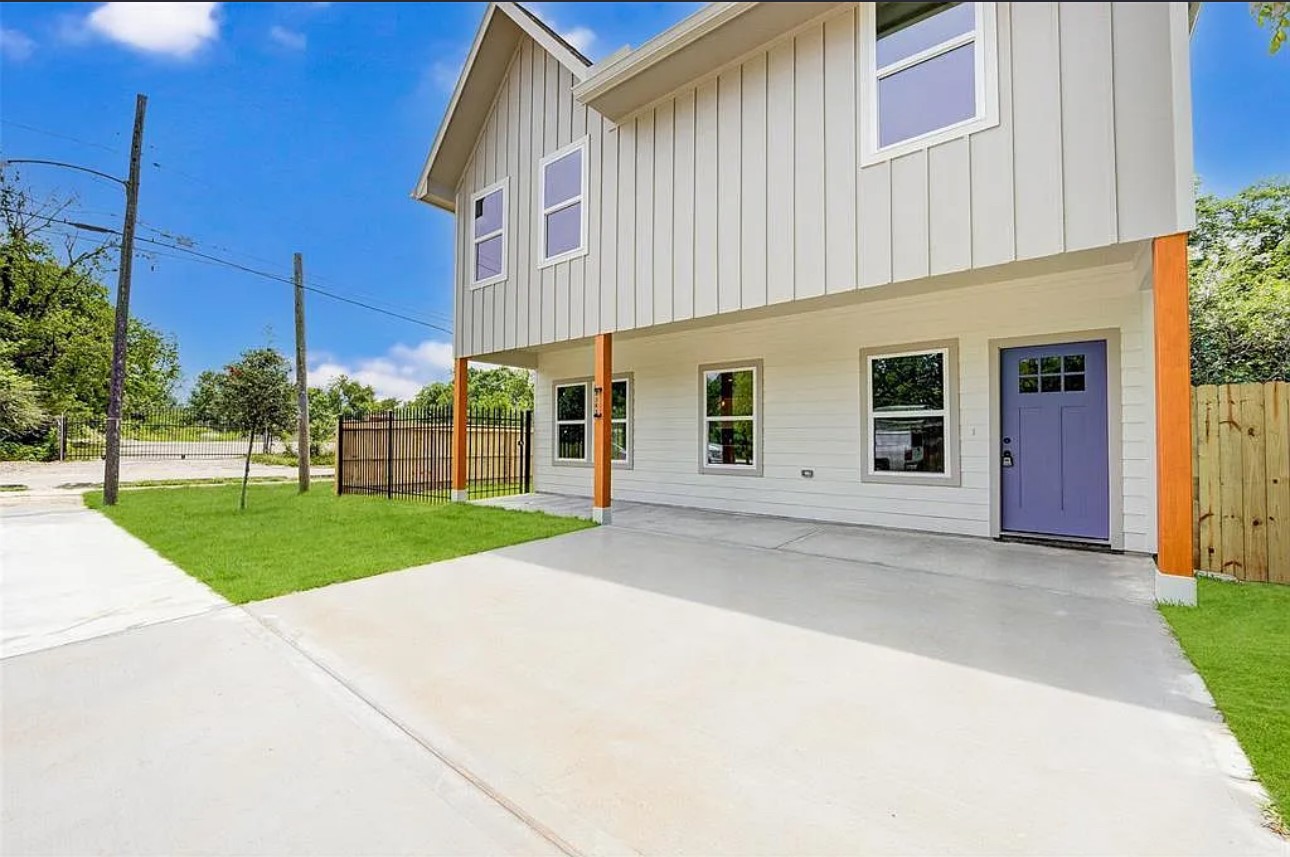 8361 Tate Street Houston, TX 77028 - Photo 14 of 16 a view of a house with a yard and garage