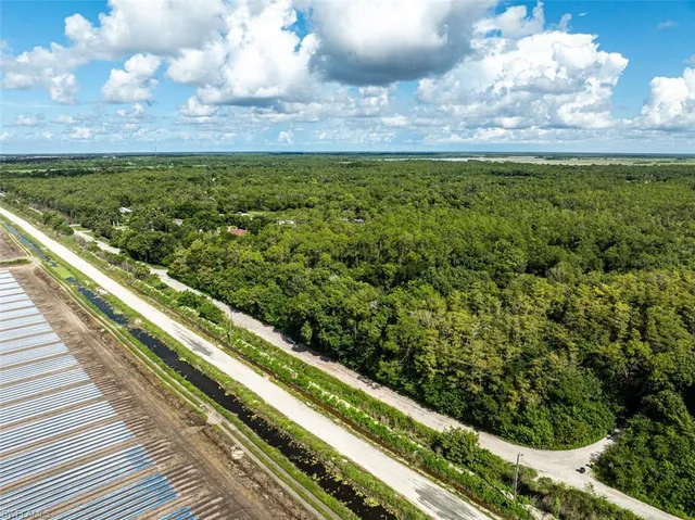 a view of a yard with an outdoor seating